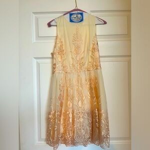 Beautiful cream dress with pale peach embroidered stitching. Worn once.